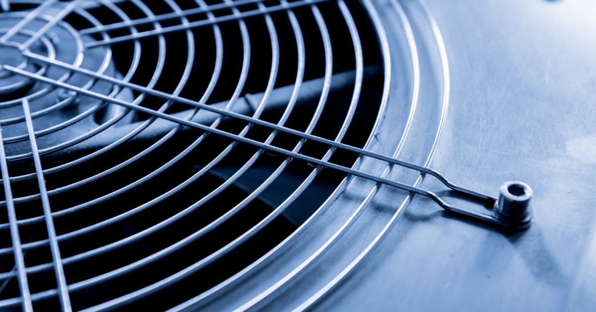 A close-up view shows the vent and vent fan on a metal air conditioning unit. Metal bolts secure the vent.